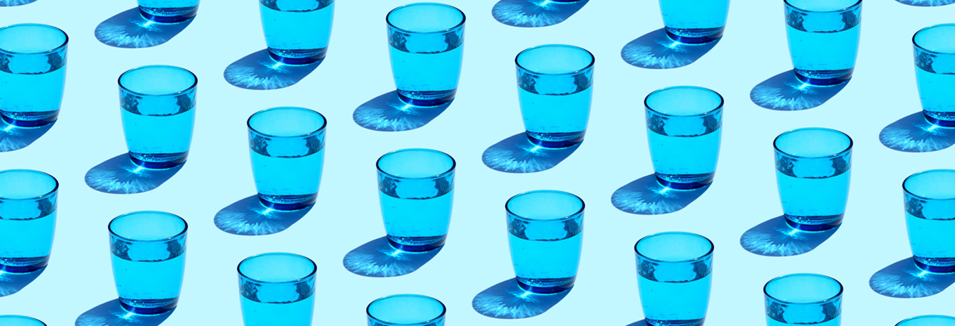 blue drinking glasses filled with water
