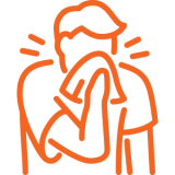 a person sneezes into a tissue