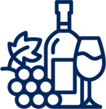 a bottle of wine with a full glass and grapes